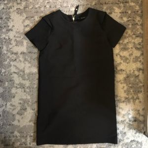 Black dress with exposed zipper on back
